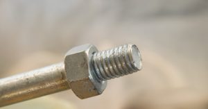 Closeup of threaded rod for machine